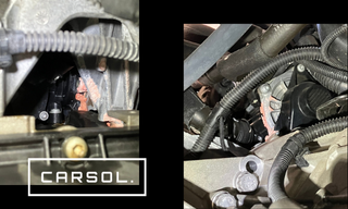 アウディA7のエンジン内部付近を拡大した写真で、冷却系統やサーモスタットハウジング周辺の状態を確認している様子。クーラント乳化トラブルの原因箇所を点検している整備作業の状況を示す画像。