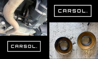 BMW 1シリーズのディファレンシャル付近の作業写真と、取り外したディファレンシャルサイドシール（左右）の比較。オイル漏れ修理のために取り外したシール部品の状態が確認できる整備写真。