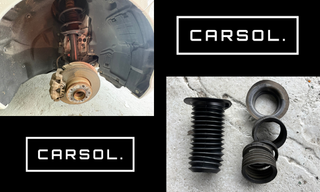 BMW1シリーズ 足回り 修理 フロントショックダストブーツ交換作業と部品 BMW 1シリーズのフロント足回り。ショックアブソーバーを取り外した状態の足回りと、交換するショックダストブーツと関連部品(新品部品)を並べた整備写真。