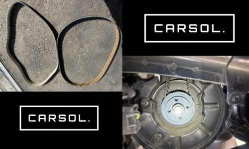 取り外したボルボV60のタイミングベルト（劣化した旧ベルトと新品ベルトの比較）と、エンジン内部のタイミングベルト周辺部品を確認している作業写真。交換前後の部品状態と作業工程が分かる整備事例。