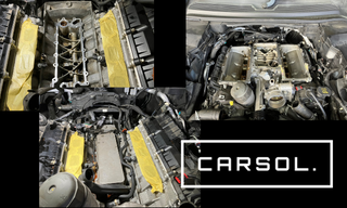 ランドローバー ディスカバリーのインテークマニホールド取り外し後の状態と作業途中のエンジンルーム（オイルクーラー・クーラントライン作業中の様子）